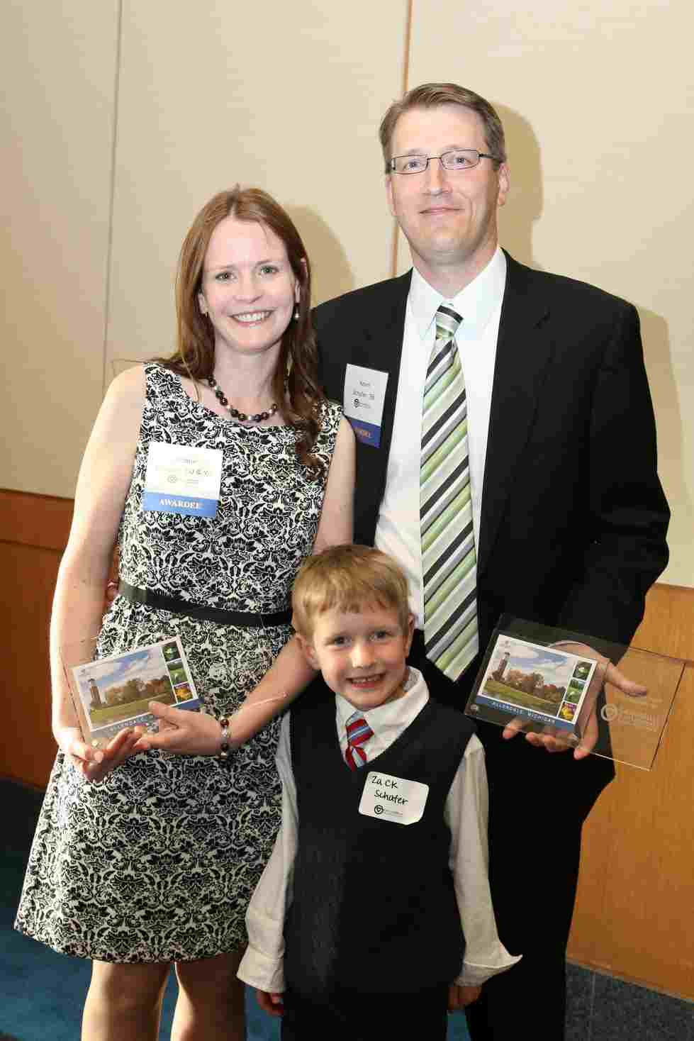 Alumni Service Award recipients Kevin, 98, and Jacqueline, 00 & 05, Schafer are pictured with their son, Zack.